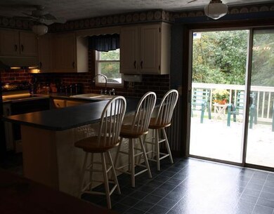 Kitchen. Eat in kitchen opens on to...