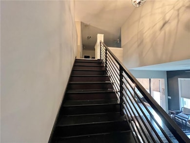 Stairs featuring a towering ceiling
