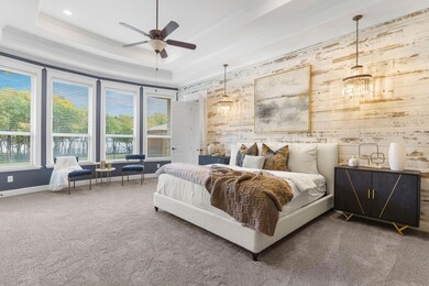 The primary suite has a decorative shiplap wall, d