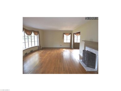 The spacious Living Room has hardwood flooring.