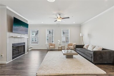 Living area featuring dark wood-style floors, base