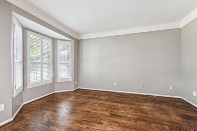 Beautiful hardwood floors and Plantation Shutters in the study.