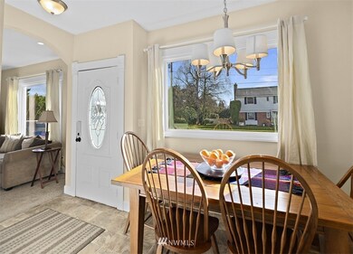 Huge picture frame window allows in an abundance of natural light!  Everyone naturally congregates in the kitchen and here there is room for them to do so.
