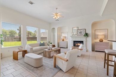 The open-concept floor plan is flooded with natura