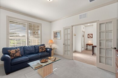 This charming office shines with plantation shutters filtering soft light and French doors that glisten as they open into your own peaceful, productive retreat.