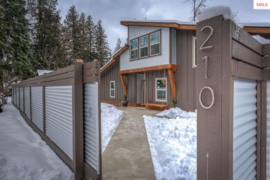 Fenced front courtyard welcomes you home.