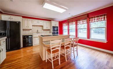 Kitchen opens up to a large formal dining room tha