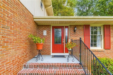 Entrance to property with brick siding