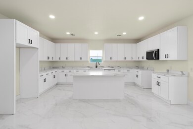 Kitchen with a center island, stainless steel mic