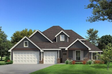 Craftsman house featuring a garage and a front law