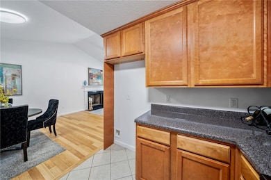 Kitchen features stainless appliances.