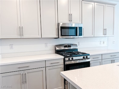 Kitchen featuring appliances with stainless steel