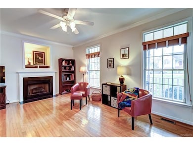 Gas fireplace, plantation blinds, hardwood floors.