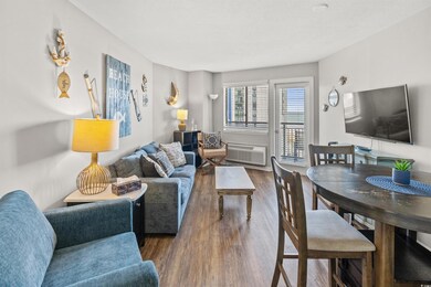 Living room featuring a wall mounted air condition