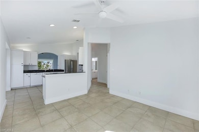 Kitchen with vaulted ceiling, stainless steel frid
