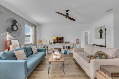 The family room features a modern ceiling fan fixt