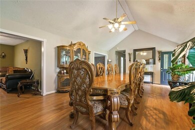 Dining room featuring lofted ceiling with beams, a