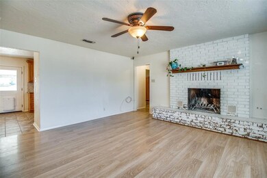 Another view of the living room and kitchen and dining are on the left