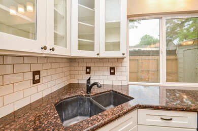 Kitchen also features a deep double sink
