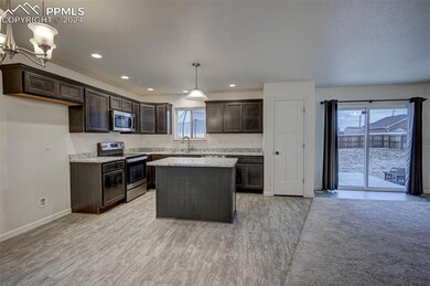 Kitchen with appliances with stainless steel finis