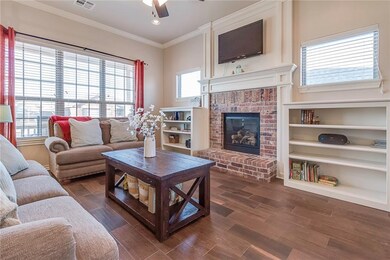 Many windows give this living room great natural l