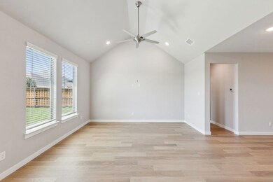 Living room in the Masters home plan by Trophy Signature Homes – REPRESENTATIVE PHOTO