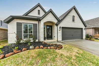 A close up of the landscaping and shutters.