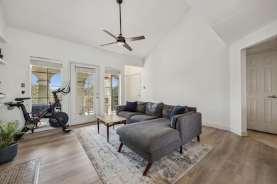 Living area with light wood-type flooring, baseboa