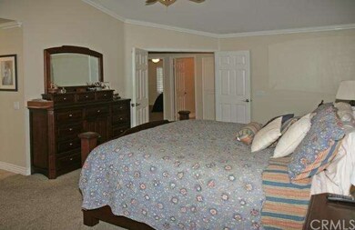 Master with crown molding, ceiling fan and access 
