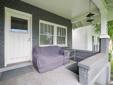 Covered porch with front basement entrance