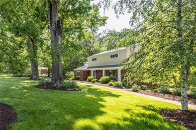 Mature trees and landscaping in front yard