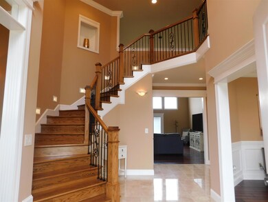 A grand two story entry invites guests into your home.