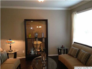 Study has crown molding, hardwoods, and a large do