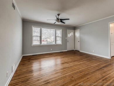 Cozy living room with beautiful, refinished hardwo