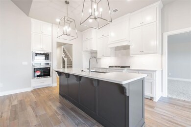 Kitchen featuring stainless steel oven, an invitin