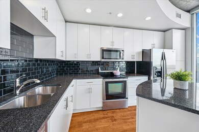 Kitchen featuring appliances with stainless steel