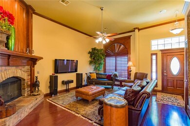 Spacious living room features wood floors, a beaut