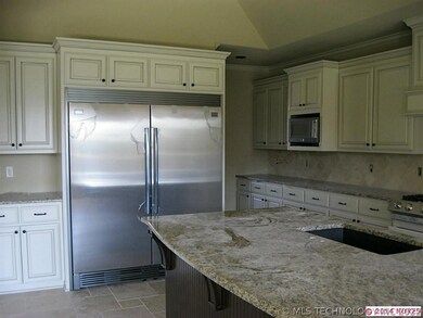 Kitchen w/ large side kick refrigerator / freezer