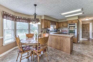 This large eat-in kitchen is 19x13 and offers a double oven (both are convection ovens and the top one is also a microwave).