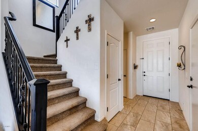 Entry, wood/iron staircase