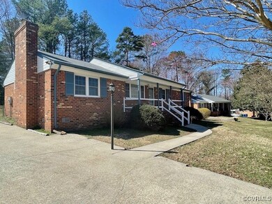 Ranch-style home with a porch, a front yard, crawl