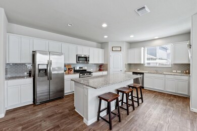 Kitchen featuring appliances with stainless steel