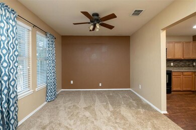 Dining room with kitchen to the right.