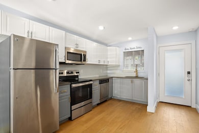 Kitchen with a sink, appliances with stainless st