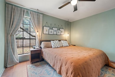 Bedroom featuring baseboards, a ceiling fan, and 