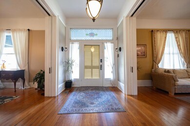 Foyer open to pocket doors on either side