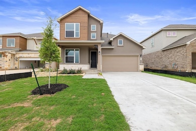 View of front of house featuring stucco siding, a