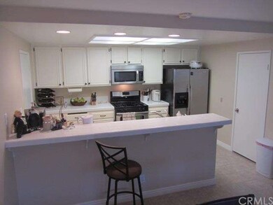Great kitchen with canned lights, stainless applia