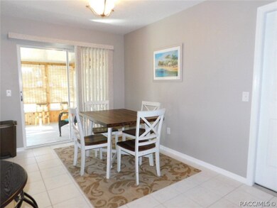 Dining area opens to enclosed sun room