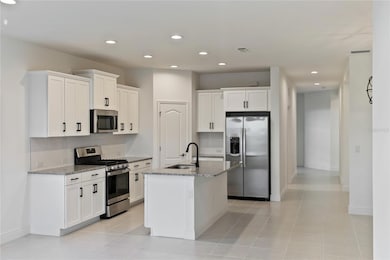 Open concept kitchen with walk in pantry